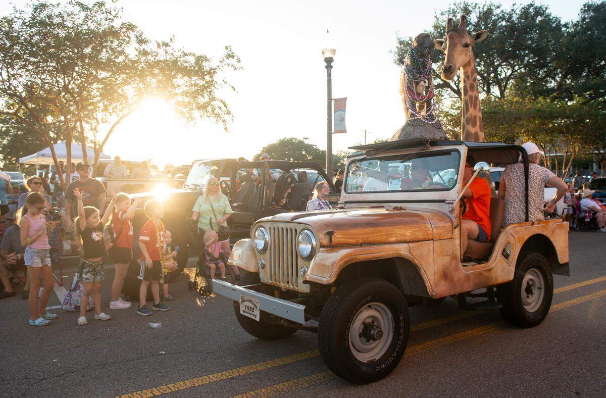 A Jeep with taxidermy animals attached to it drives down Jeff Davis Avenue during the Long Beach Parade in Long Beach, one of the events in Cruisin’ The Coast, on Monday, Oct. 7, 2024.
