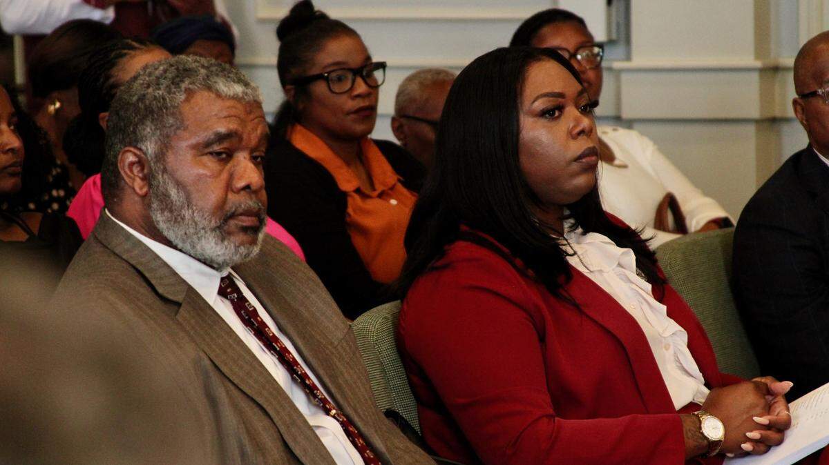Carrissa Corbett, right, a Democratic candidate for Ward 6 City Council in Gulfort, sits with her attorney, Warren Conway, as incument Republican R.Lee Flowers challenges her residency.