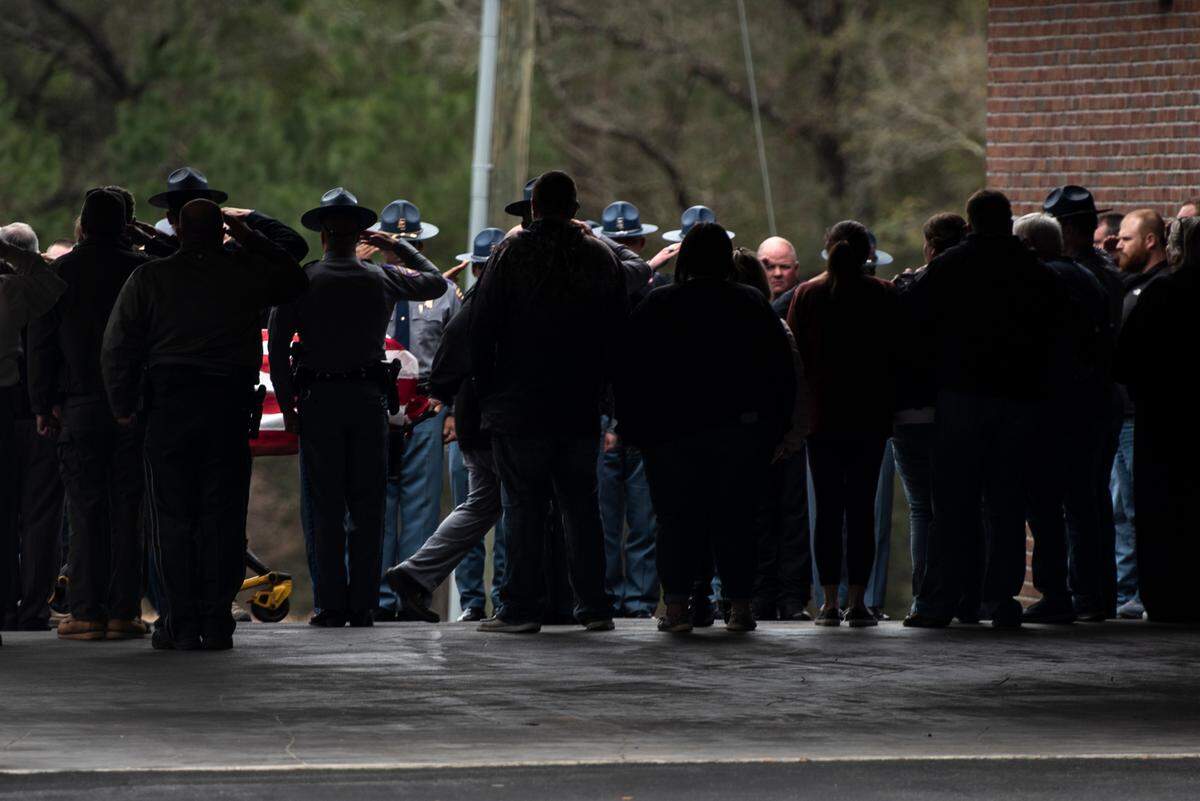 The body of Jeremy Malone, an officer with the George County Sheriff’s Office, is escorted into Moments Funeral Home in Lucedale on Friday, Jan. 5, 2024. Malone was killed on Thursday when conducting a traffic stop near a Dollar General.