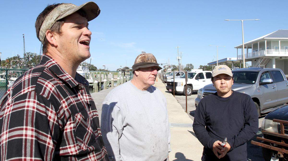 TIM ISBELL/SUN HERALD 
 Rudy Tolar, James "Catfish" Miller and Rum Phan discuss their fears concerning the release of flood waters at the Bonnet Carre spillway, Wednesday, Jan. 6, 2016. The fishermen are afraid it could devastate Coast oysters.