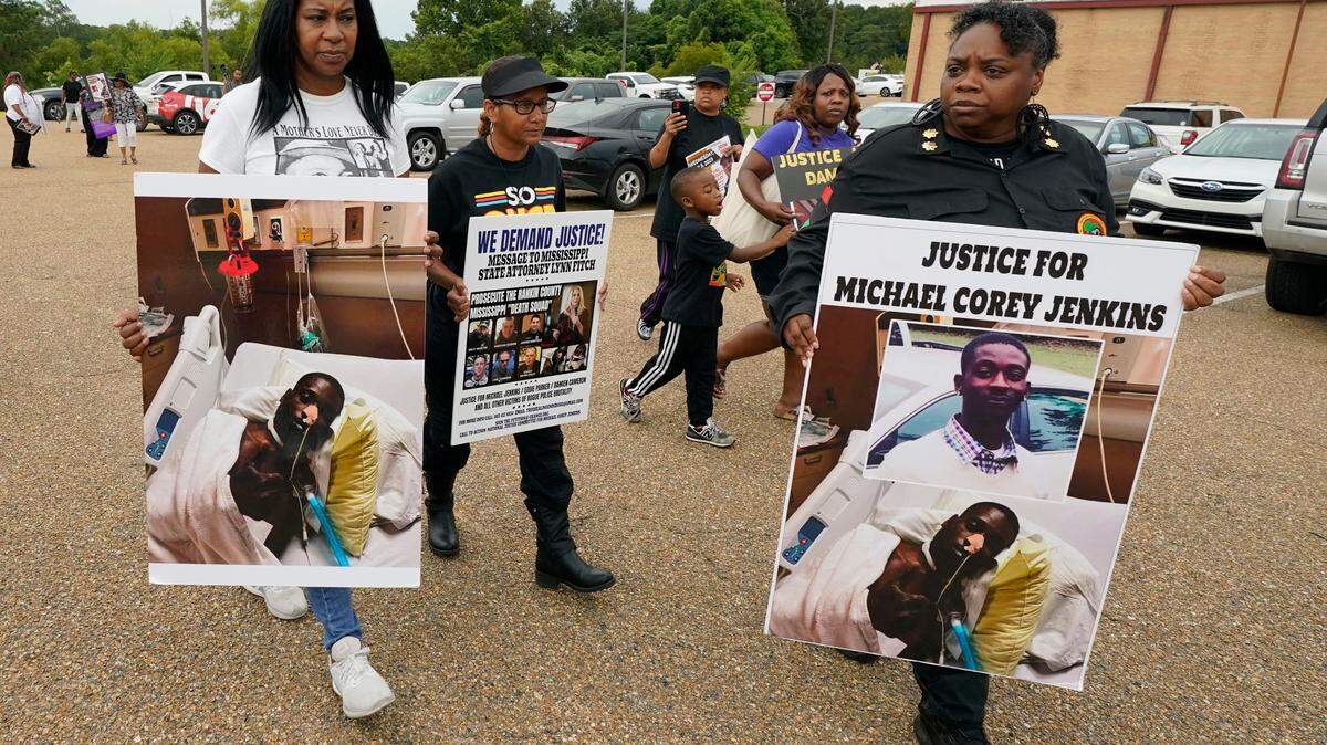 Activists march toward the Rankin County Sheriff’s Office in Brandon in July, calling for the termination and prosecution of Rankin County Sheriff Bryan Bailey for running a law enforcement department that allegedly terrorizes and brutalizes minorities. Six white former law enforcement officers in Mississippi have pleaded guilty to a racist assault on Michael Corey Jenkins and his friend Eddie Terrell Parker, who are Black. (AP Photo/Rogelio V. Solis, File)