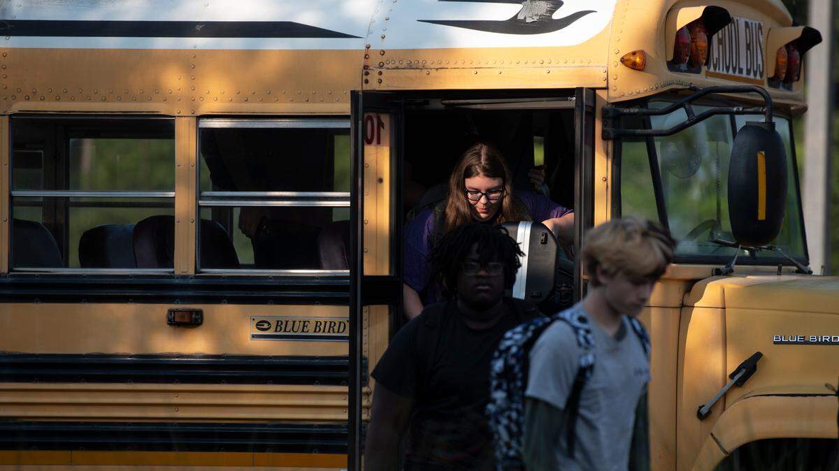 Students arrive for the first day of school at Biloxi High School in Biloxi on Thursday, July 27, 2023.
