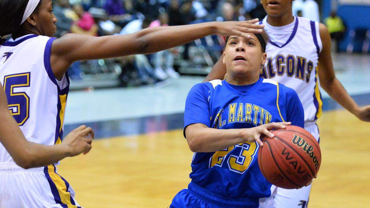 BOB SMITH/SPECIAL TO THE SUN HERALD 
 St. Martin's Deona Morgan (23) drives against Columbus during Girls MHSAA 6A Quarterfinal play at Jackson State University in Jackson.(Photo-Bob Smith)