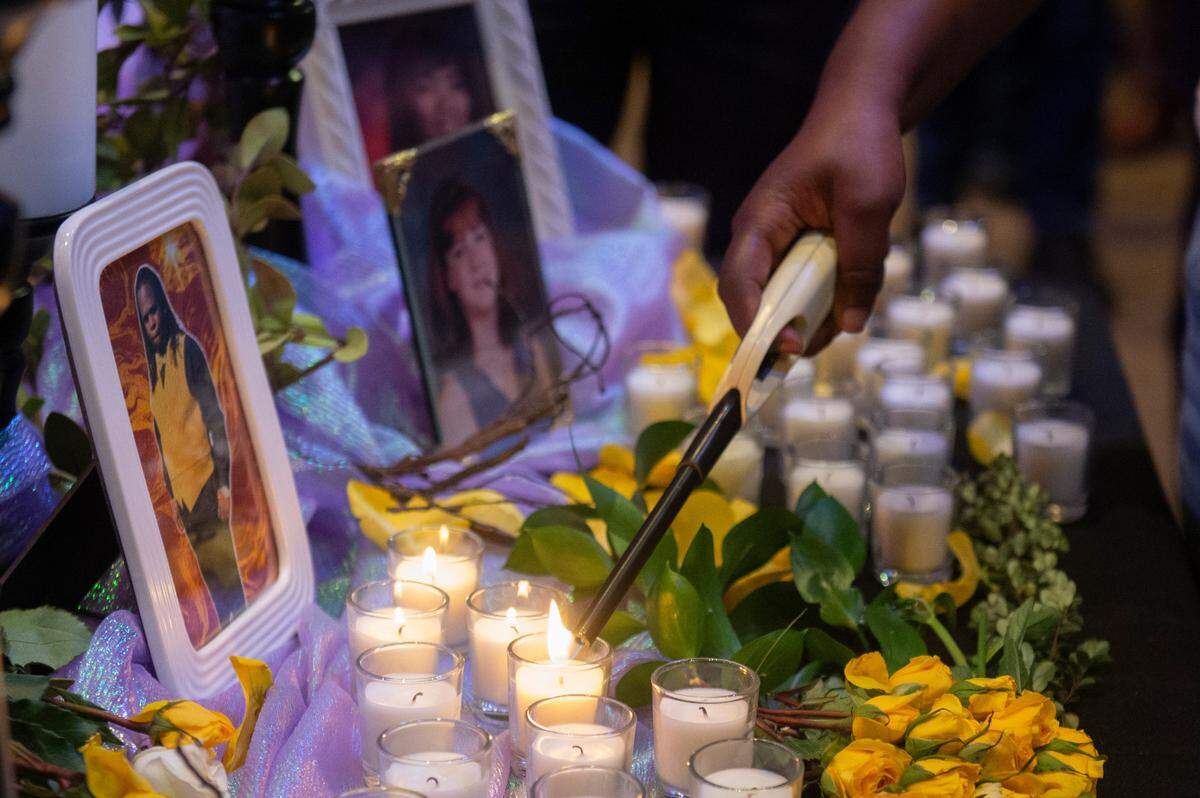 Family members light candles in front of a portrait of Anthony Oatis during a coast-wide candlelight ceremony as a part of National Crime Victims’ Rights Week at First Baptist Church of Gulfport on Tuesday, April 29, 2025. Oatis was killed in June of 2022.