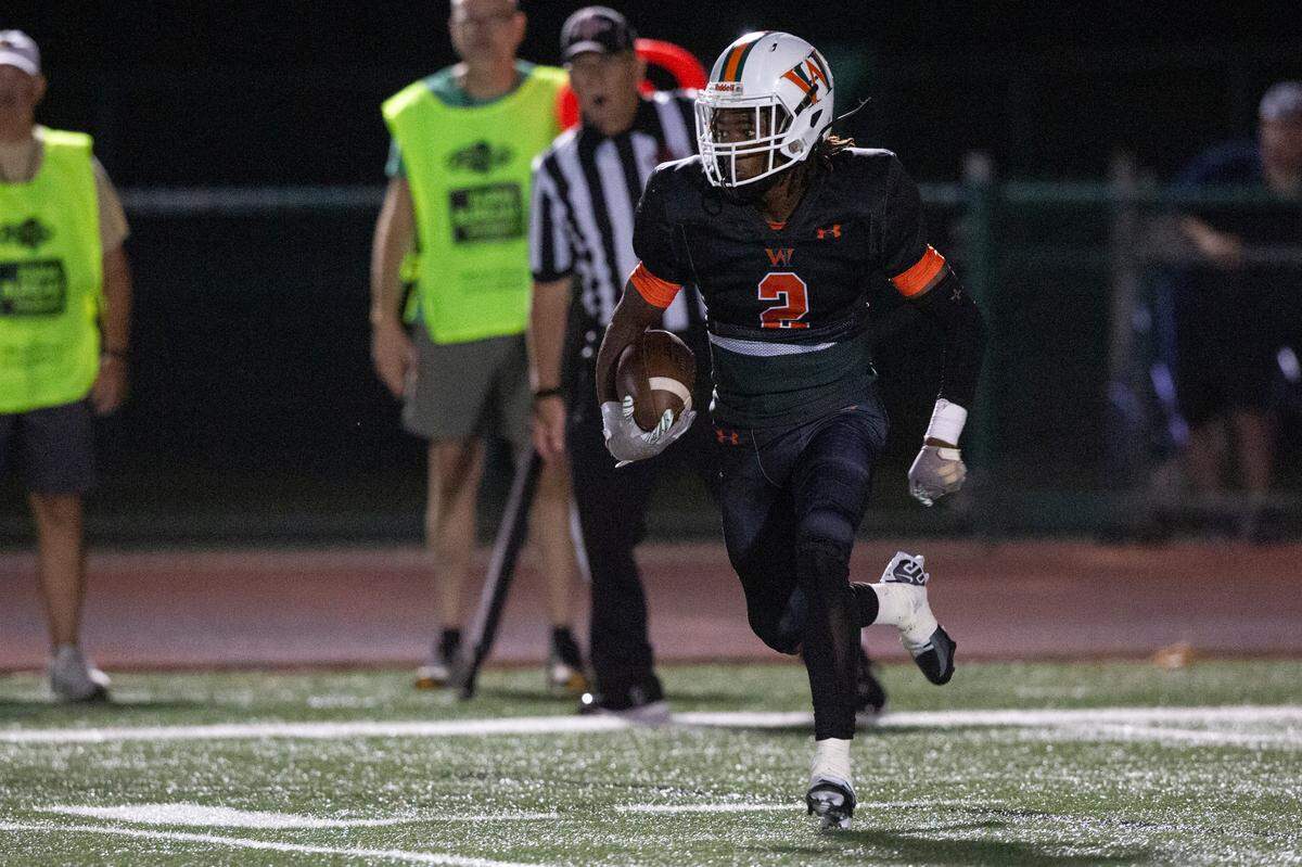 West Harrison’s Tyson Johnson runs the ball down the field during a game against Hancock at West Harrison High School in Harrison County on Friday, Oct. 6, 2023.