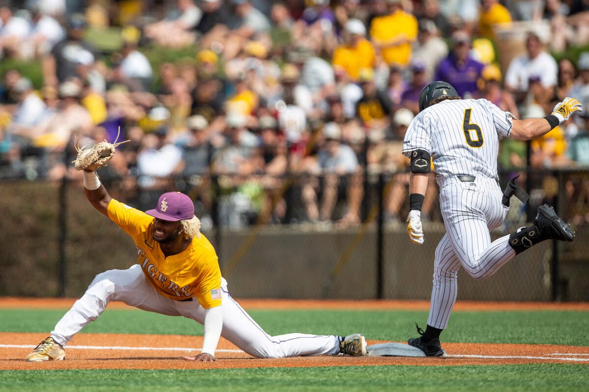 LSU’s Tre’ Morgan cheers as he tags out Southern Miss’s Will McGillis during the NCAA Regionals game at Pete Taylor Park in Hattiesburg on Monday, June 6, 2022.