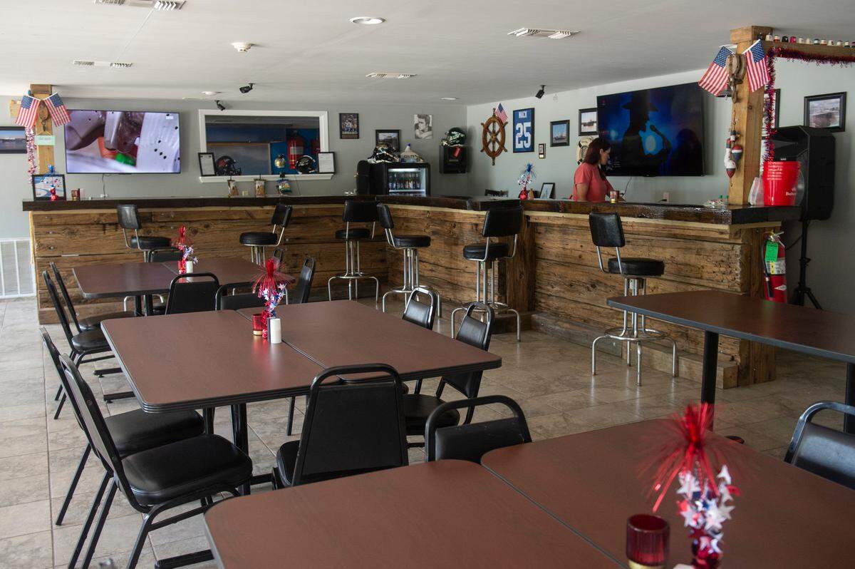 The bar and dining area inside Woolmarket Grocery in Woolmarket, where a grand opening is Friday, July 12.