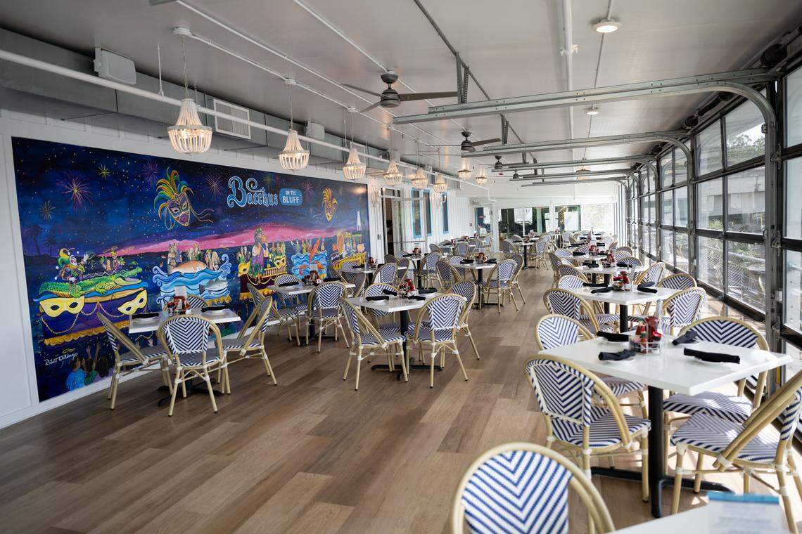The main dining room at the new Bacchus on the Bluff in Gulfport is open to the views of Bernard Bayou. Overhead doors can be opened to open the room to the breezes.