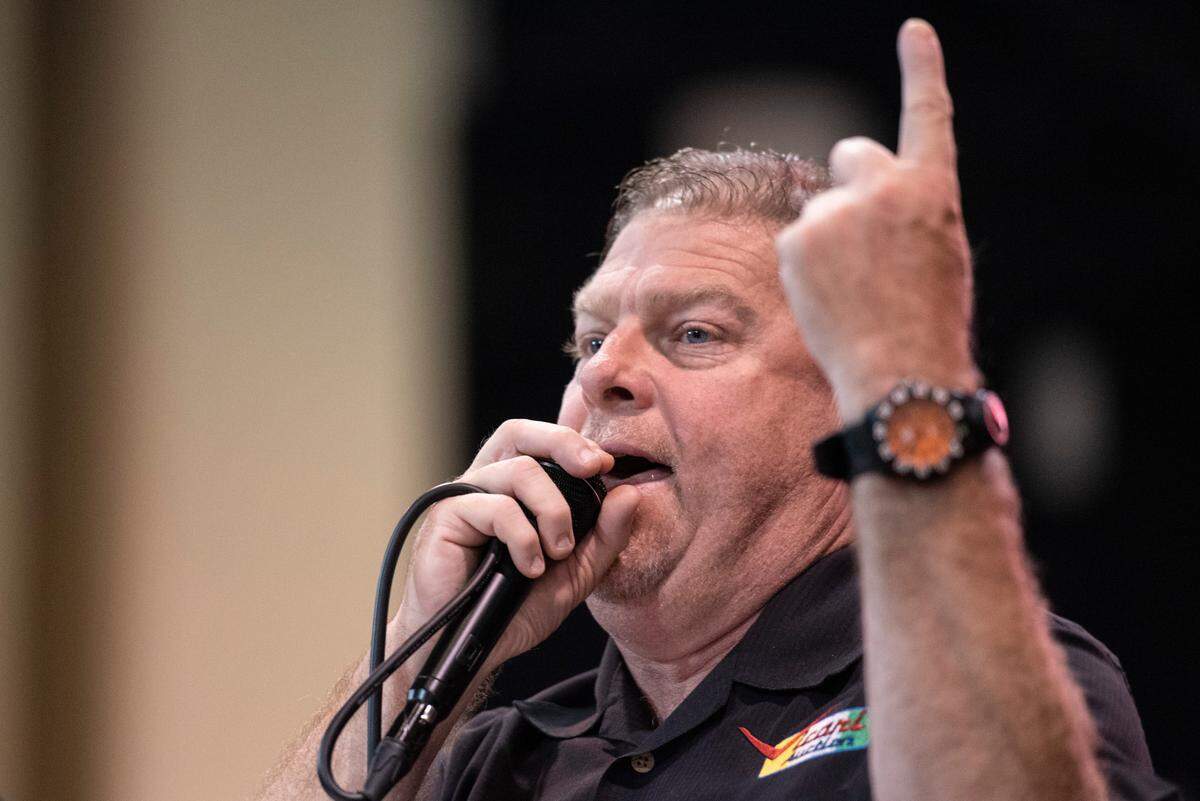 Auctioneer Joey Fortner, of Dahlonega, Georgia, auctions off a car during the Vicari car auction at the Mississippi Coast Coliseum and Convention Center on Thursday, Oct. 7, 2021.