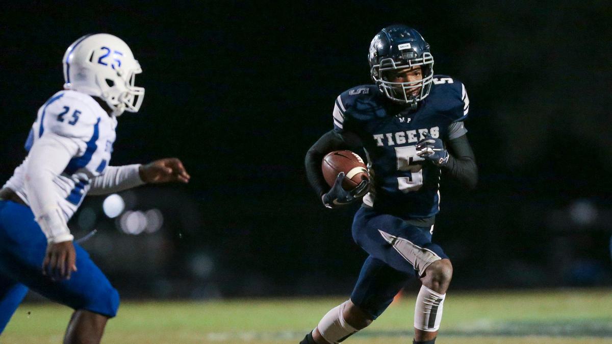 Moss Point wide receiver Larry Simmons (5) carries during the first round 4A playoff game between Moss Point and Stone at Moss Point, Friday, November 8, 2019.