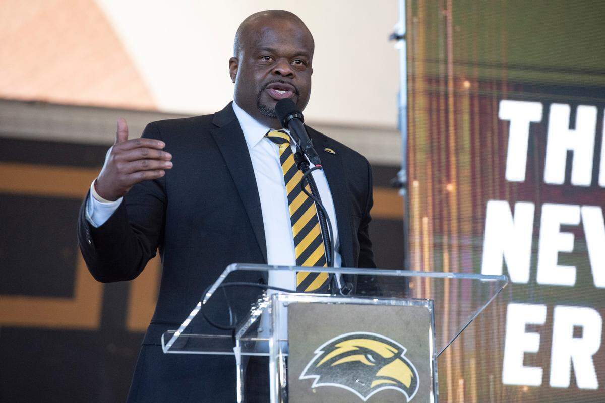 Southern Miss’ new head football coach Charles Huff makes an introductory speech during a public welcome celebration for Huff at The Rock in Hattiesburg on Thursday, Dec. 12, 2024.