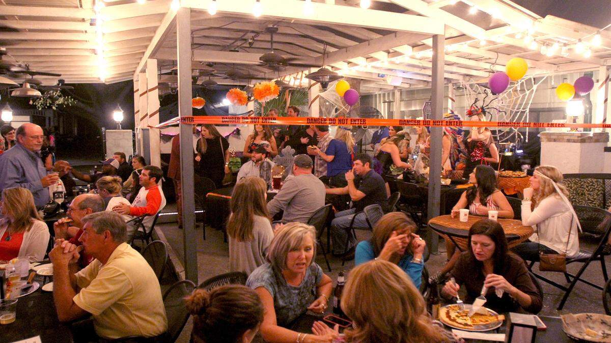 TIM ISBELL/SUN HERALD 
 The night life in downtown Ocean Springs is a popular affair as establishments on Washington and Government streets get plenty of business, Saturday, Oct. 25, 2014.