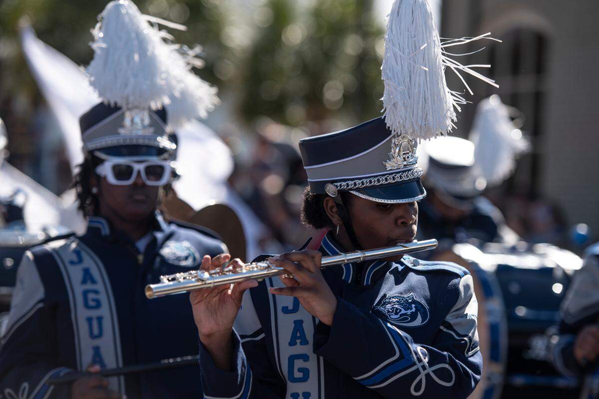 Members of Jefferson Davis County High School’s band marches during the Gulf Coast Carnival Association’s Mardi Gras parade in Biloxi on Tuesday, Feb. 13, 2024.
