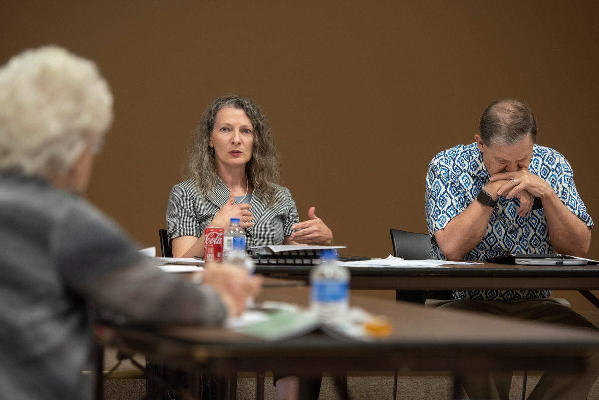 Harrison County Library Director Sarah Crisler-Ruskey, center, speaks during a Harrison County library system board meeting at West Biloxi Library in Biloxi on Monday, July 25, 2022.