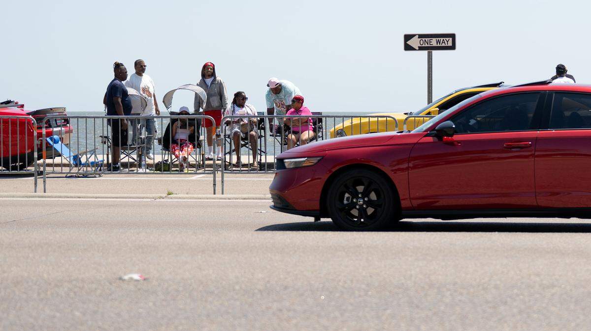 Some people gather on Beach Boulevard during Black Spring Break on Saturday.