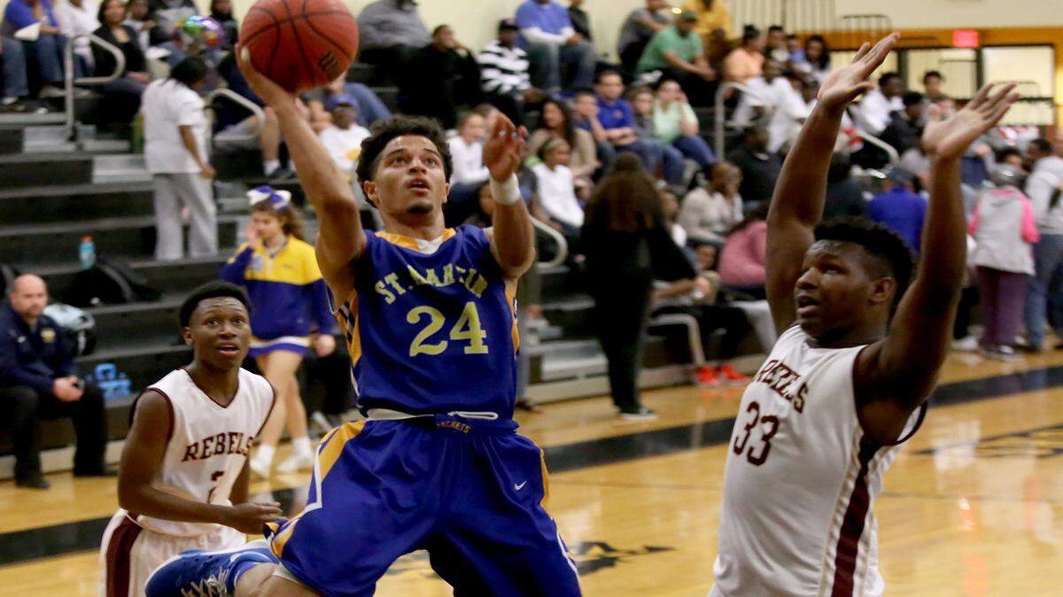 AMANDA McCOY/SUN HERALD 
 St. Martin's Stacee St. Julian, middle, has been selected to represent the state in the 26th annual Mississippi-Alabama All-Star Game. The game is set for 7 p.m. Friday at Mississippi College.
