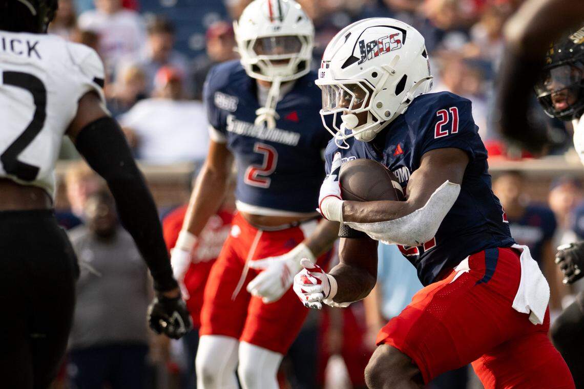 South Alabama running back Keenan Phillips (21) picks up yards Saturday against Southern Miss.