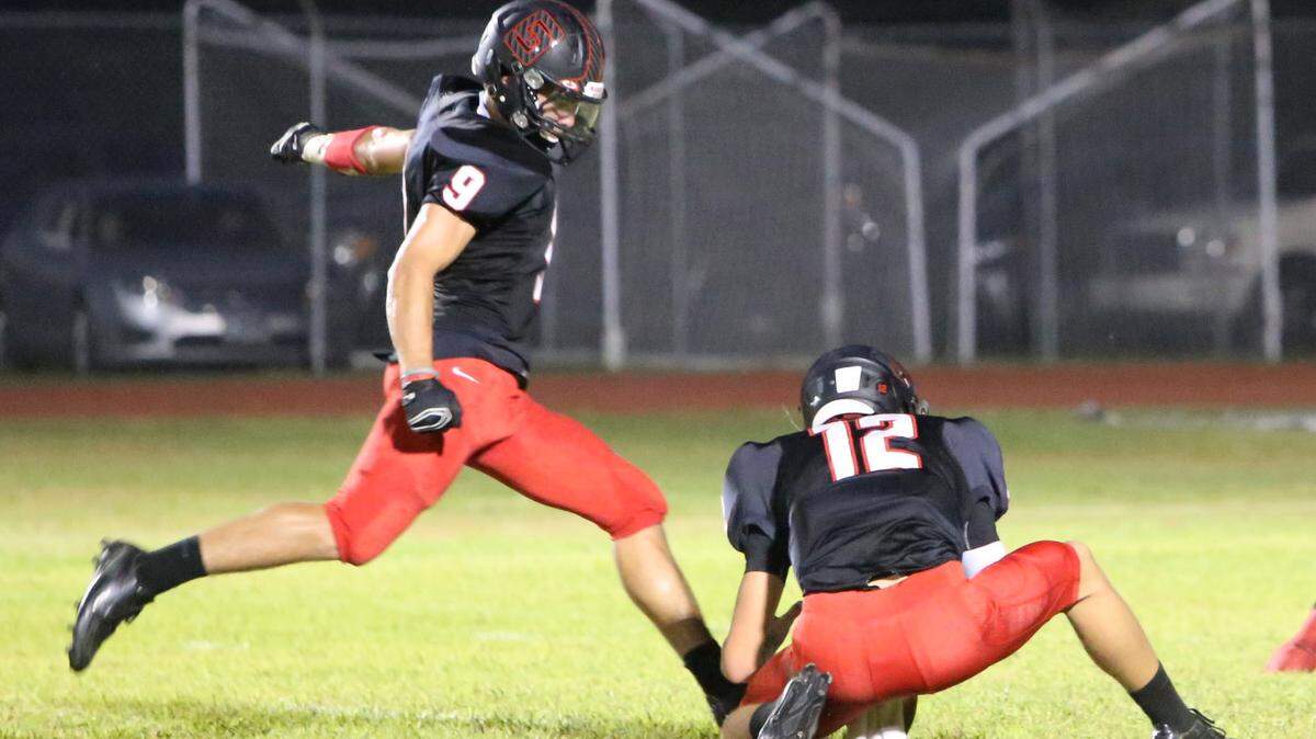 St. Stanislaus kicker Mason Favre puts up an extra point during the first quarter of their game against D'Iberville at Brother Martin Stadium in Bay St. Louis on Friday Sept. 18, 2015.