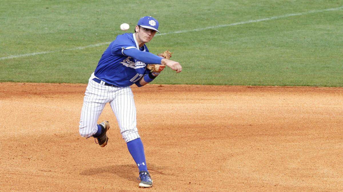 TIM ISBELL/SUN HERALD 
 Ocean Springs third baseman Drew Windham throws to first after running down a ball that bounced off of his glove, Saturday, March 26, 2016.