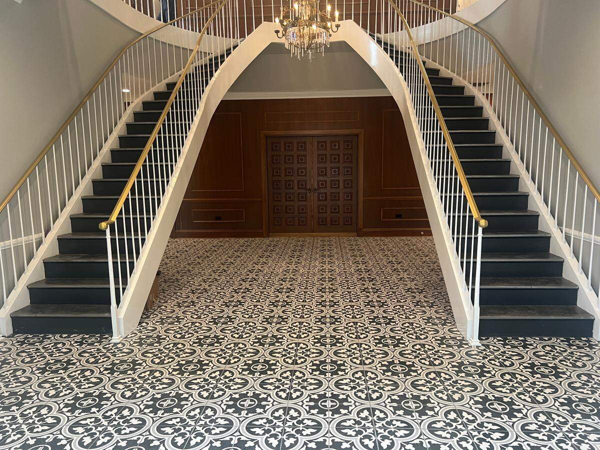 Twin staircases create an impressive welcome in the lobby of District Flats, new luxury apartments in downtown Pascagoula.