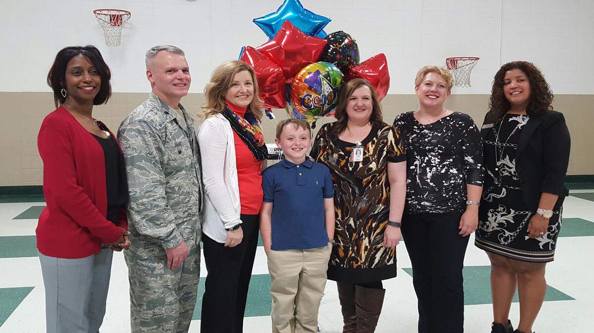 MISSISSIPPI COUNCIL ON ECONOMIC EDUCATION 
 Nine-year-old Eric Bray is congratulated by, from left, Dr. Melanie Nelson, principal, Jeff Davis Elementary School; Kevin and Robin Bray, Eric's parents; Traci McDill, Eric's teacher, Selena Swartzfager, President, Mississippi Council of Economic Education; Diana Robinson, The Peoples Bank.