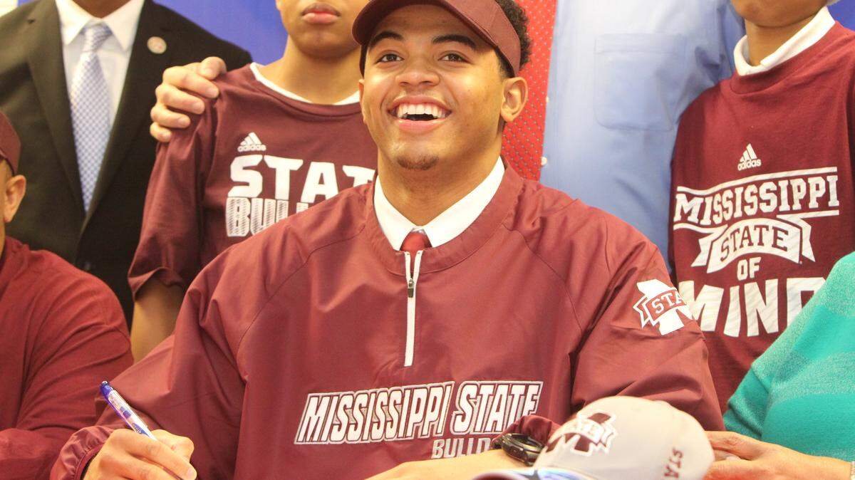 JOHN FITZHUGH/SUN HERALDPascagoula High School's Keith Joseph Jr. poses with his family for National Signing Day photos on Wednesday Feb. 4, 2015.