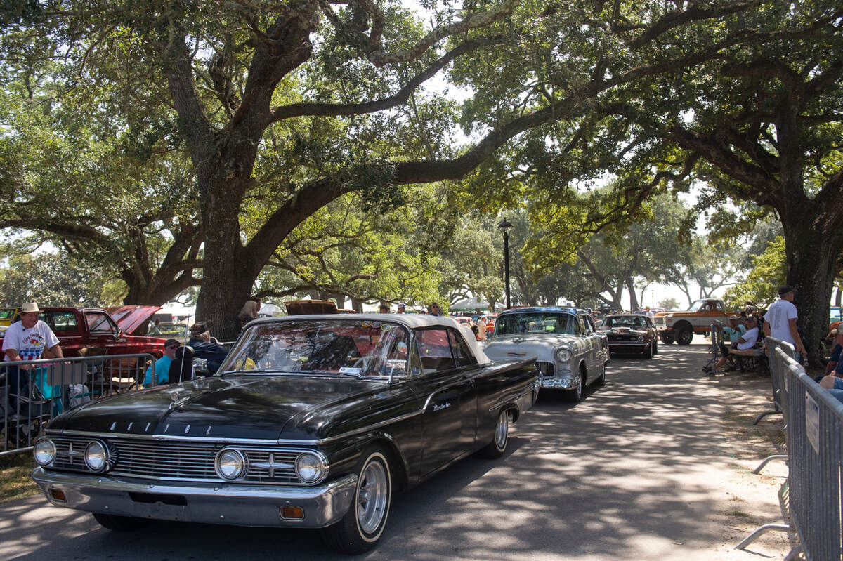 Cruisers drive through Cruisin’ Central at Centennial Plaza during Cruisin’ the Coast on Tuesday, Oct. 3, 2023.