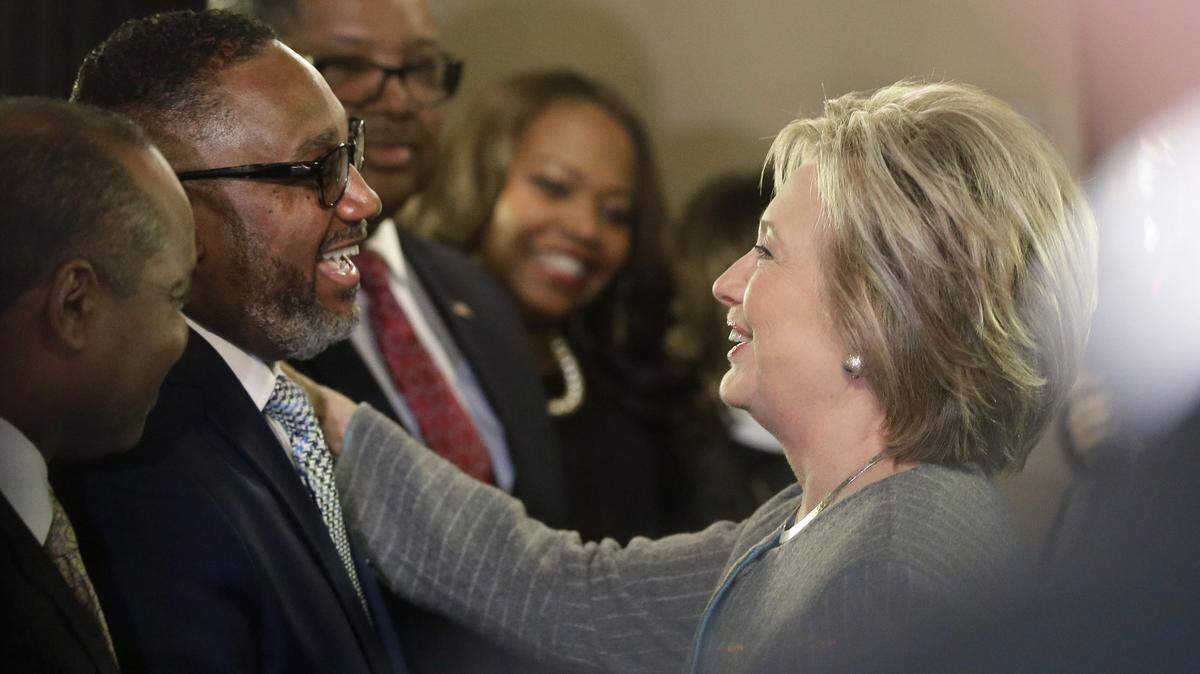 Democratic presidential candidate Hillary Clinton meets with The Rev. Kenneth J. Flowers of the Greater New Mt. Moriah Missionary Baptist Church before meeting with African American ministers, Saturday, March 5, 2016, in Detroit. (AP Photo/Carlos Osorio)