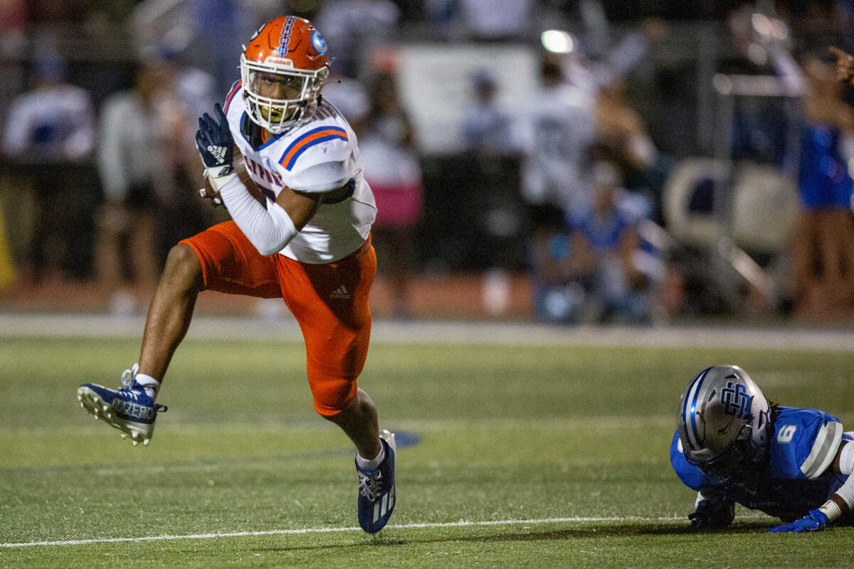 Gulfport’s Gavin Brown avoids getting tackled by Ocean Springs during a game at Greyhound Stadium in Ocean Springs on Friday, Oct. 28, 2022.