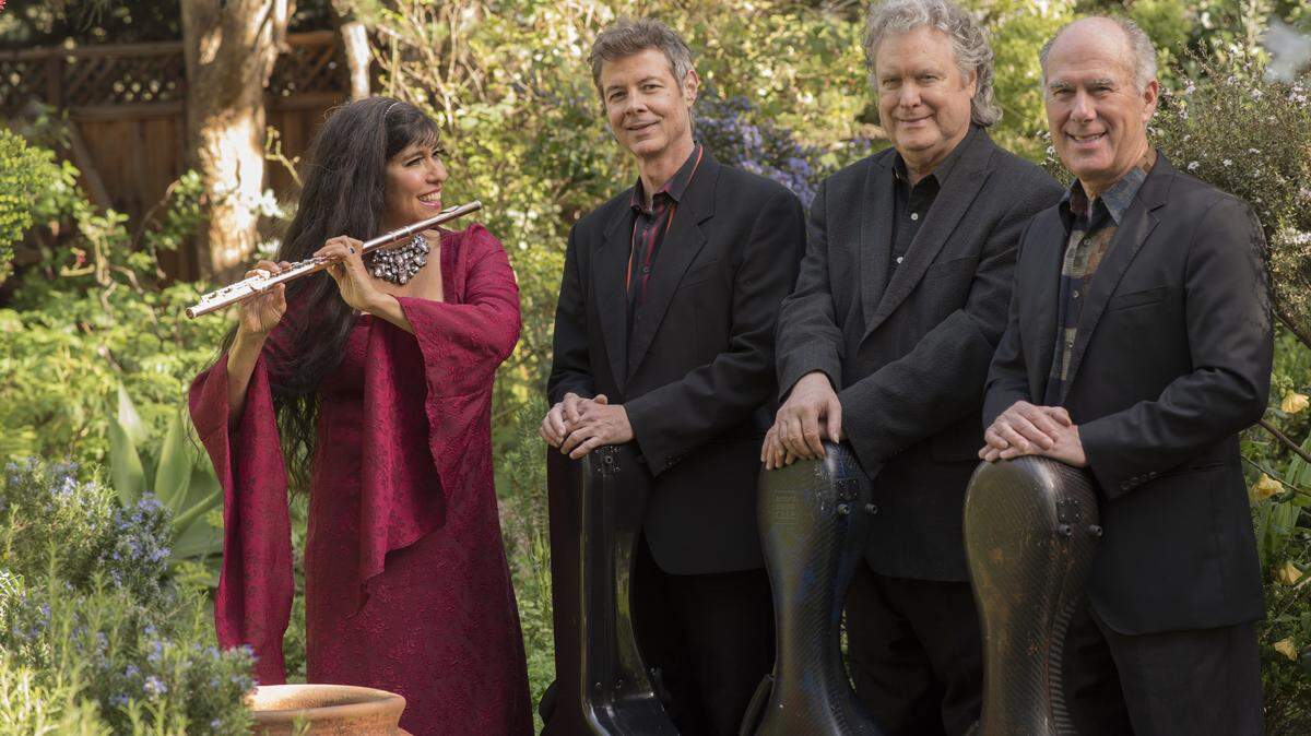 COURTESY ARTS UNDER THE DOMEFestival of Four consists of Grammy-nominated flutist Viviana Guzman, left, classical guitarist Richard Patterson, flamenco guitarist Guillermo Rios and guitarist Stevan Pasero, who has sold more than 3 million recordings featuring nuevo-flamenco, jazz, classical and Latin music genres. The group will perform at 7 p.m. Saturday as part of the Arts Under the Dome concert series.