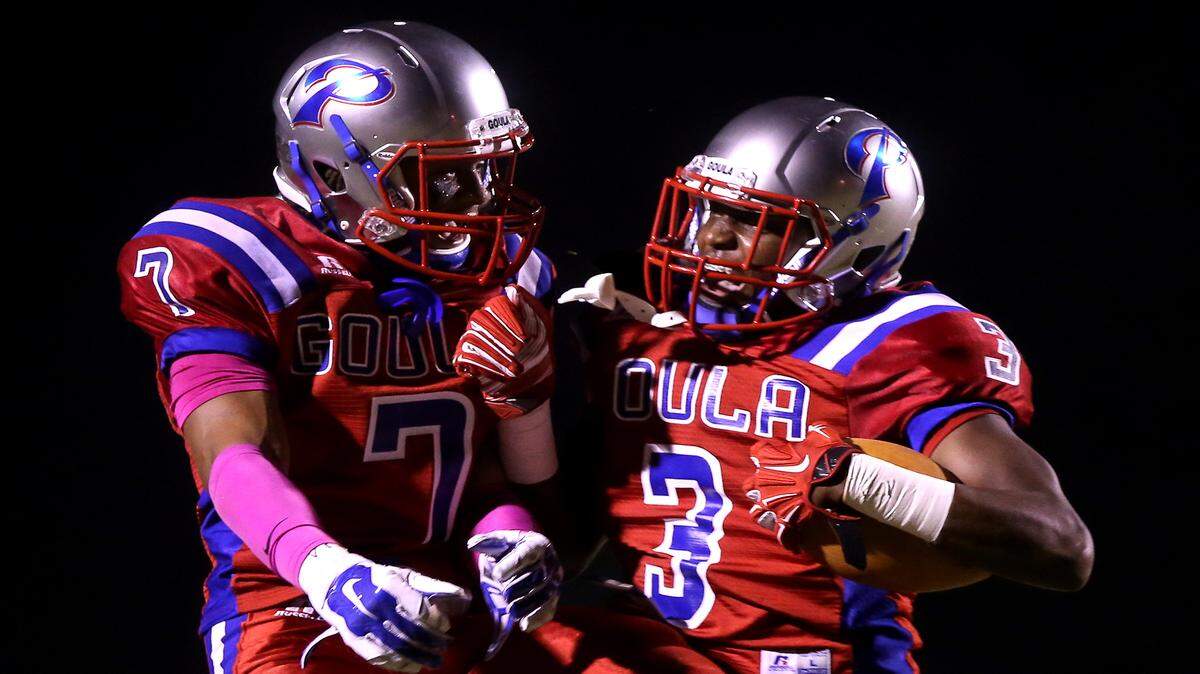 AMANDA McCOY/SUN HERALDPascagoula's Jakwaize Walker, left, and Cartreal Davison celebrate after Davison scored a touchdown in last Friday's game against Hattiesburg.