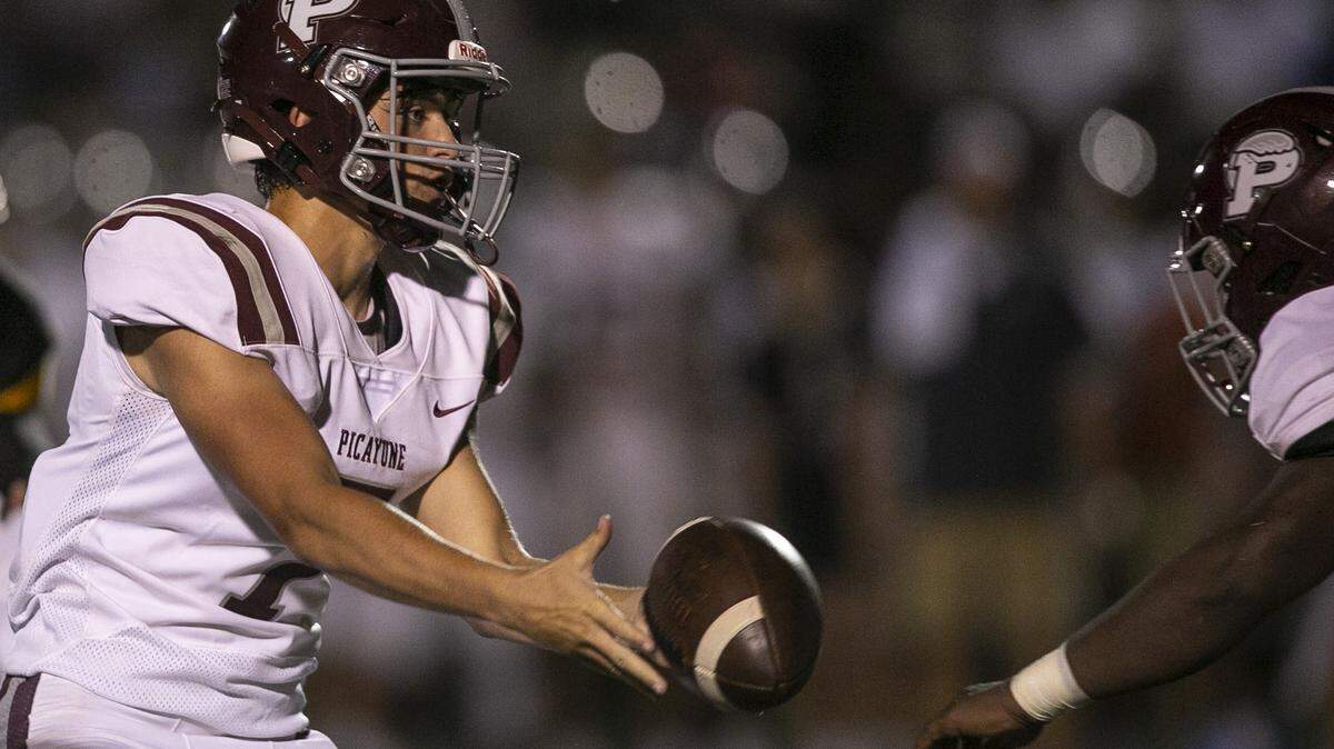 Picayune quarterback Dawson Underwood passes the ball to a teammate during the D’Iberville versus Picayune game at D’Iberville Stadium on Friday, Sept. 17, 2021.