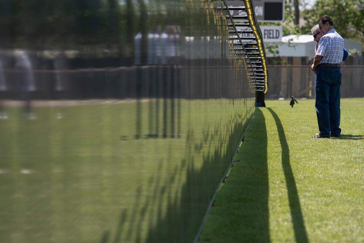 Visitors look at names on The Wall That Heals, a traveling three-quarter scale replica of the Vietnam Veterans Memorial in D.C., while it is on display at the D’Iberville Sports Complex in D’Iberville on Thursday, April 10, 2025.