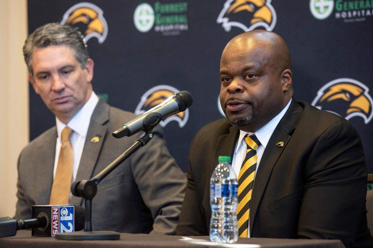 Southern Miss Athletic Director Jeremy McClain, left, and new head football coach Charles Huff during Huff’s first press conference at The Rock in Hattiesburg on Thursday, Dec. 12, 2024.