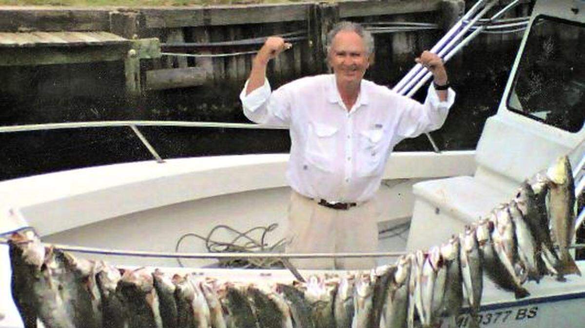 Dr. Patrick Louis Pierce, retired Coast eye doctor, shows off his trout catch about five years ago from a boat owned by his son-in-law, George Boddie. Pierce earned the name of Trout King among his fishing buddies at the Gulfport Yacht Club, which started an annual Trout King contest in good humor in hopes to dethrone him.