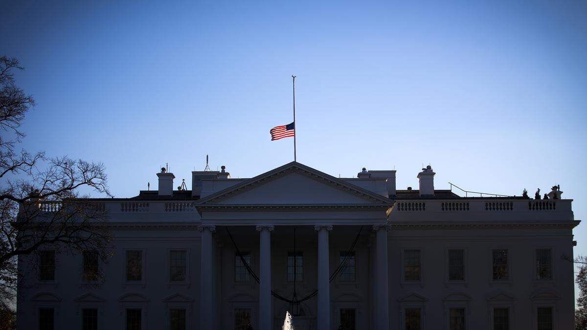 The flag flies at half-staff over the White House in Washington, Dec. 4, 2015. The FBI is now treating the San Bernardino shooting by a husband and wife that killed 14 and wounded 21 as an act of terrorism, an agency official said Friday. (Doug Mills/The New York Times)