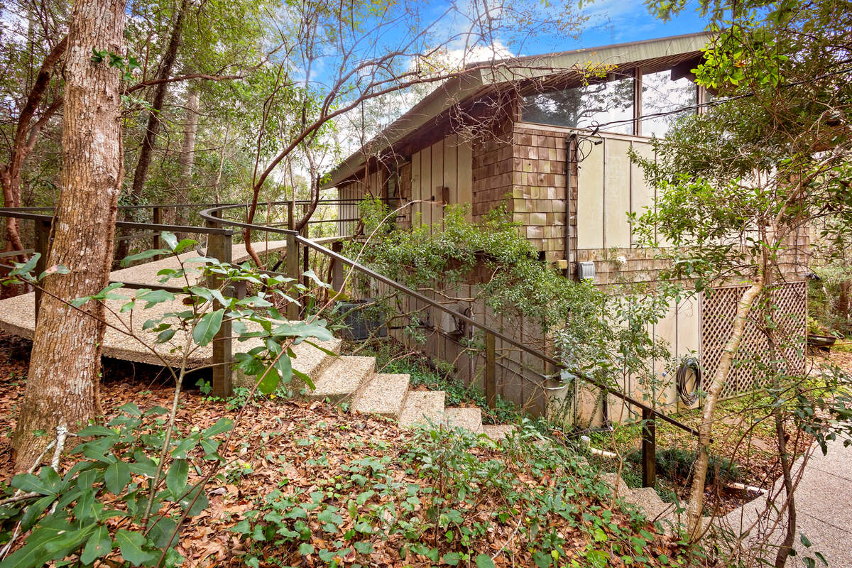 Designer and builder Carroll Ishee, who was self taught, formed his own concrete. The thin layer he used as a ramp on this Brumbaugh Road home in Ocean Springs almost appears to float.