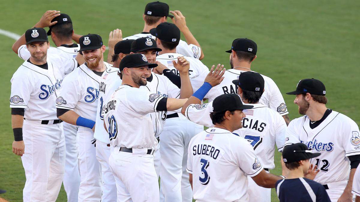 AMANDA McCOY/SUN HERALDThe Biloxi Shuckers file onto the field as a group after the announcement system amplifiers blew out before introducing the team before the start of the first home game of the Biloxi Shuckers on Saturday, June 6, 2015. 