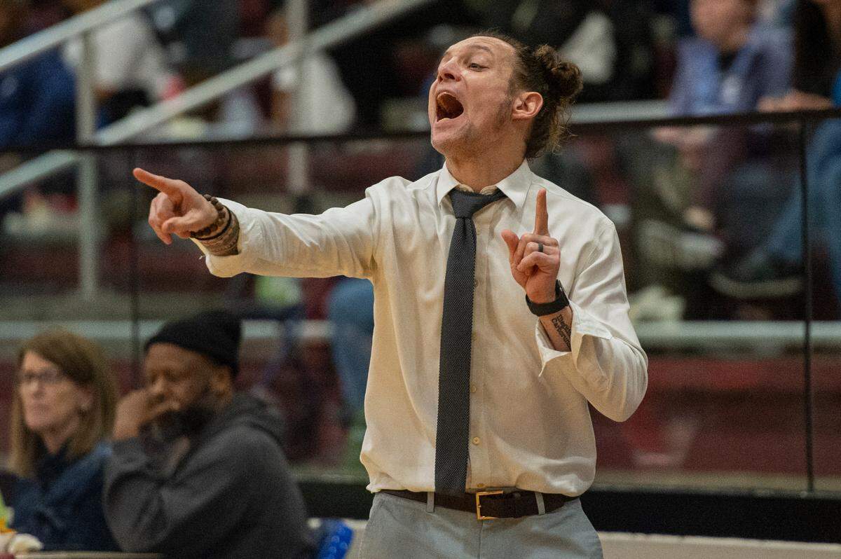 Bay High Head Coach Kelton Thompson talks to his players on the court during a game against Pass Christian in Pass Christian on Tuesday, Jan. 23, 2024.