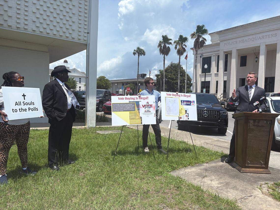 Mississippi Republican Party Chairman Mike Hurst, right, speaks during a news conference on Wednesday, May 28, 2025 in which he alleged Gulfport residents had received meal vouchers in exchange for voting in the mayoral race. The Rev. Eddie Hartwell Sr., second from left, said the voucher idea was his and denied being affiliated with any party or breaking the law.