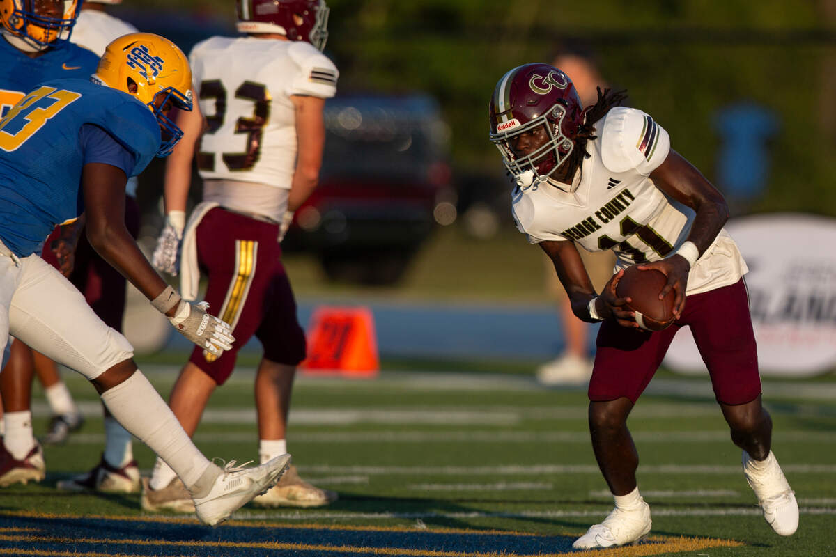 George County’s Brenn Moody (#11) runs the ball during a Jamboree game against St. Martin at St. Martin High School in Ocean Springs on Friday, Aug. 23, 2024.