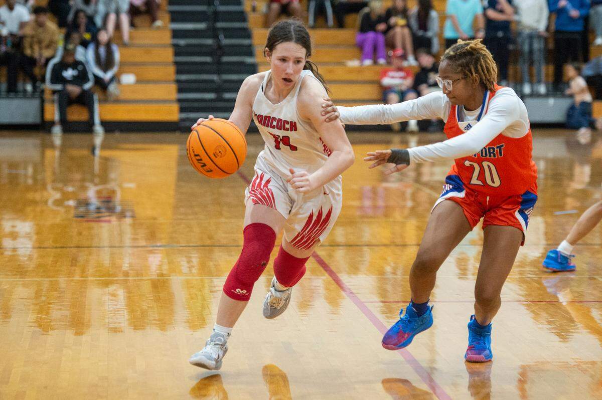Hancock’s Anslee James dribbles past Gulfport during a game against Gulfport at Hancock High School in Kiln on Tuesday, Jan. 10, 2023.