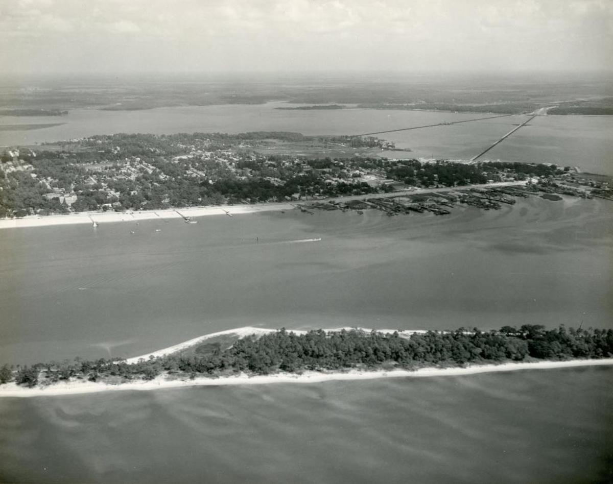 Deer Island, not far from the Biloxi and Ocean Springs mainlands, has long been an island of mystery and tales of pirates, campers... and ghosts. Audrey Murphy, a mid-20th century Biloxi photographer, captured this aerial image of Deer before Hurricane Camille and other storm and natural erosion changed its number of trees.
