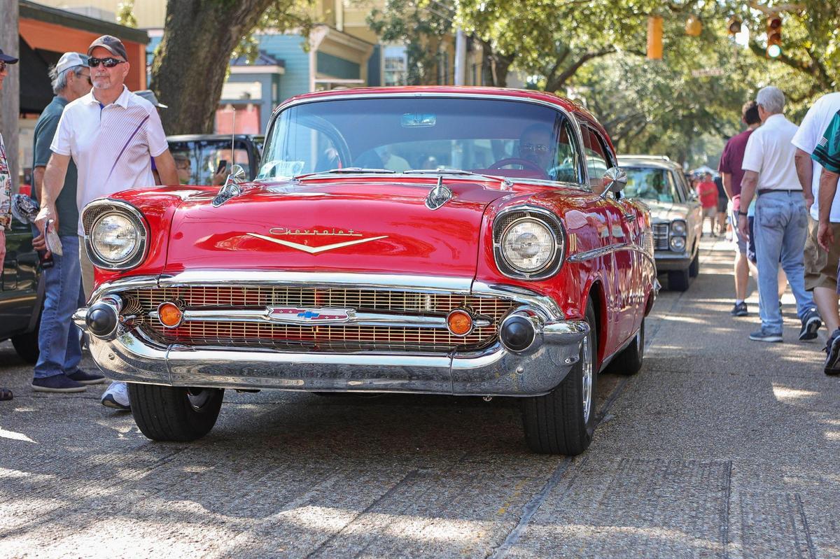 An old Chevy cruises on Washington Avenue in Ocean Springs during Cruisin’ the Coast 2021. Ocean Springs is one of several venues open Thursday through Saturday.