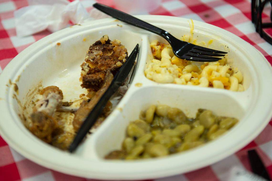 A half-eaten plate of mac and cheese, beans and chicken at Ms. Audrey’s Southern Kitchen in Gaston Point on Tuesday, Dec. 21, 2021.