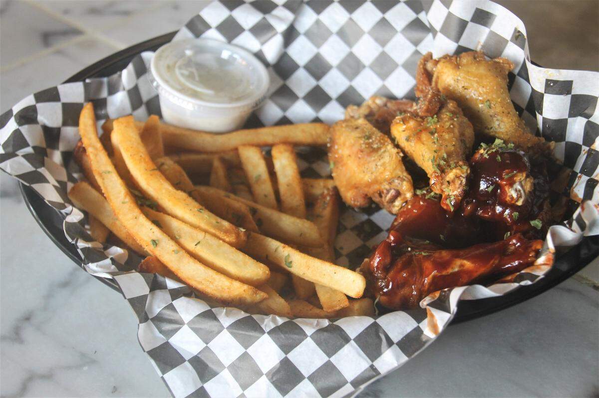 Barbecue and garlic lemon wings at Temptations Food & Spirits on Howard Avenue in downtown Biloxi.
