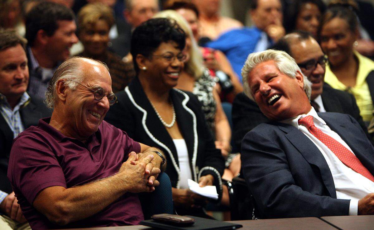 Singer Jimmy Buffett, left, and Margaritaville CEO John Cohlan, right, laugh at comments made by Gaming Commission Chairman Jerry St. Pe’ during a Gaming Commission meeting in 2011.