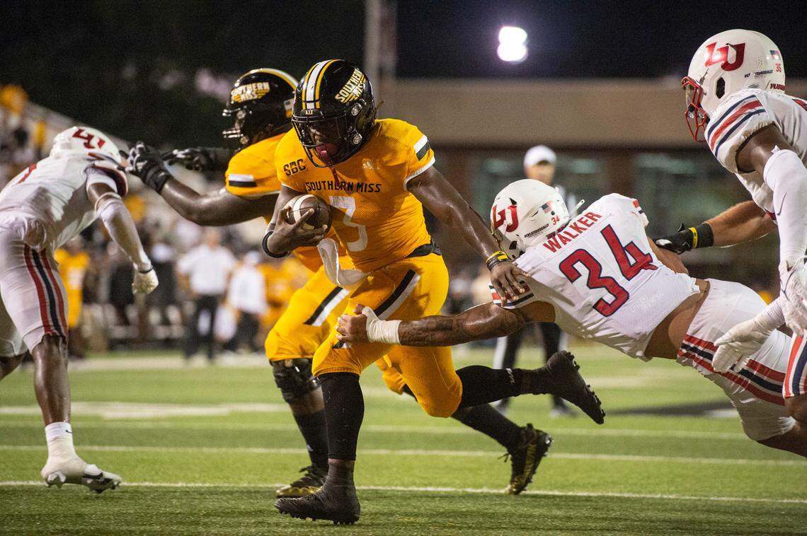 Southern Mississippi running back Frank Gore Jr. (3) gets tackled by Liberty during a NCAA college football game in Hattiesburg, Miss., Saturday, Sept. 3, 2022. Southern Mississippi lost 29-27