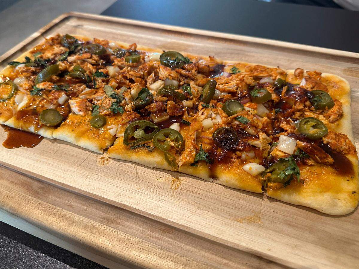 The BBQ chicken flatbreat at By the Fig and the Olive in Ocean Springs on Wednesday, July 10, 2024.
