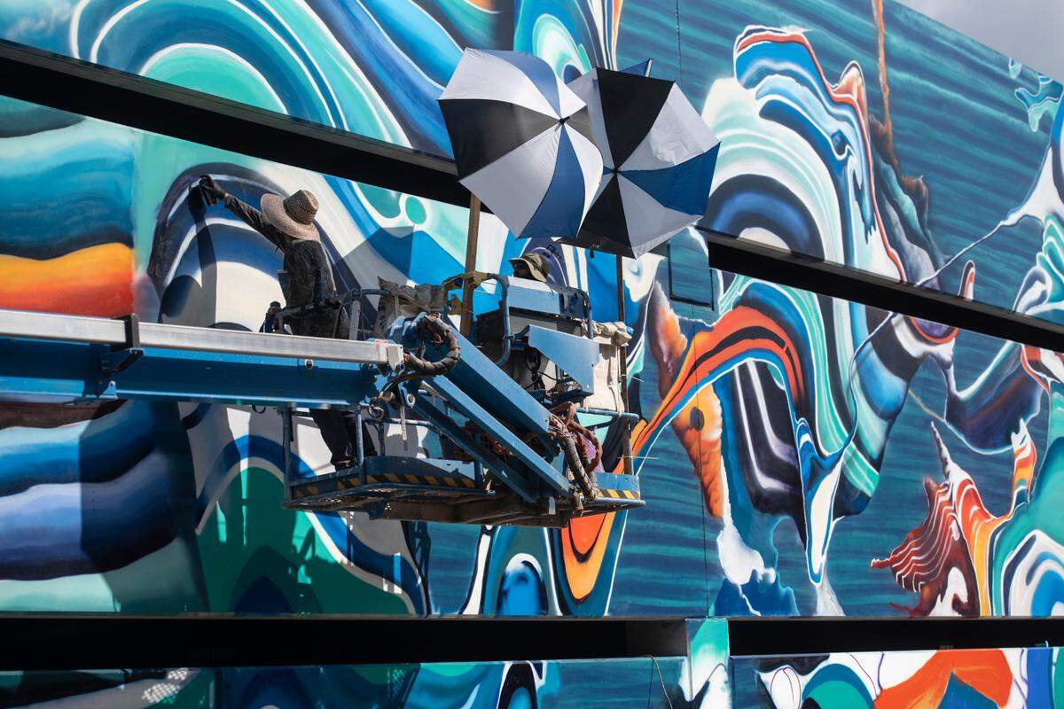The parking garage at OS1515 Downtown includes a colorful mural by artist Douglas Hoekzema. The city received $8 million in state grant funds for the project, which includes public parking. 